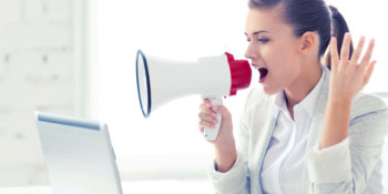 picture of strict businesswoman shouting in megaphone